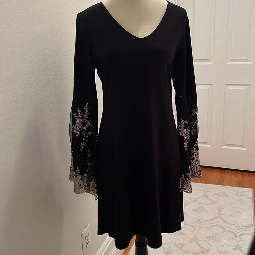 Stunning bell sheaves dress.
